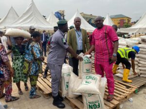 An image of the Nigeria Customs Service National Public Relations Officer at an auction site.